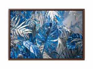 Blue tropical leaf canvas art with silver palm foliage for glamorous modern wall decor.