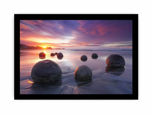 Coastal sunset boulder canvas print for serene beach house or living room decor.