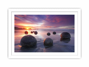 Coastal sunset boulder canvas print for serene beach house or living room decor.