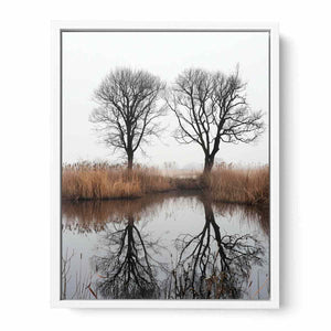 Misty winter trees reflected in still marsh water for serene vertical wall art.