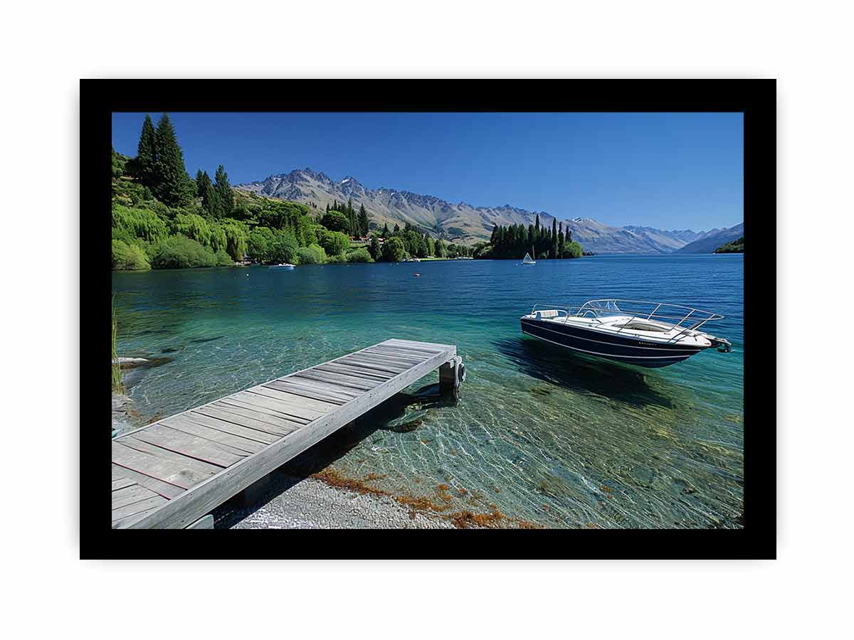Mountain lake canvas art with dock, boat and clear blue water for modern interiors.