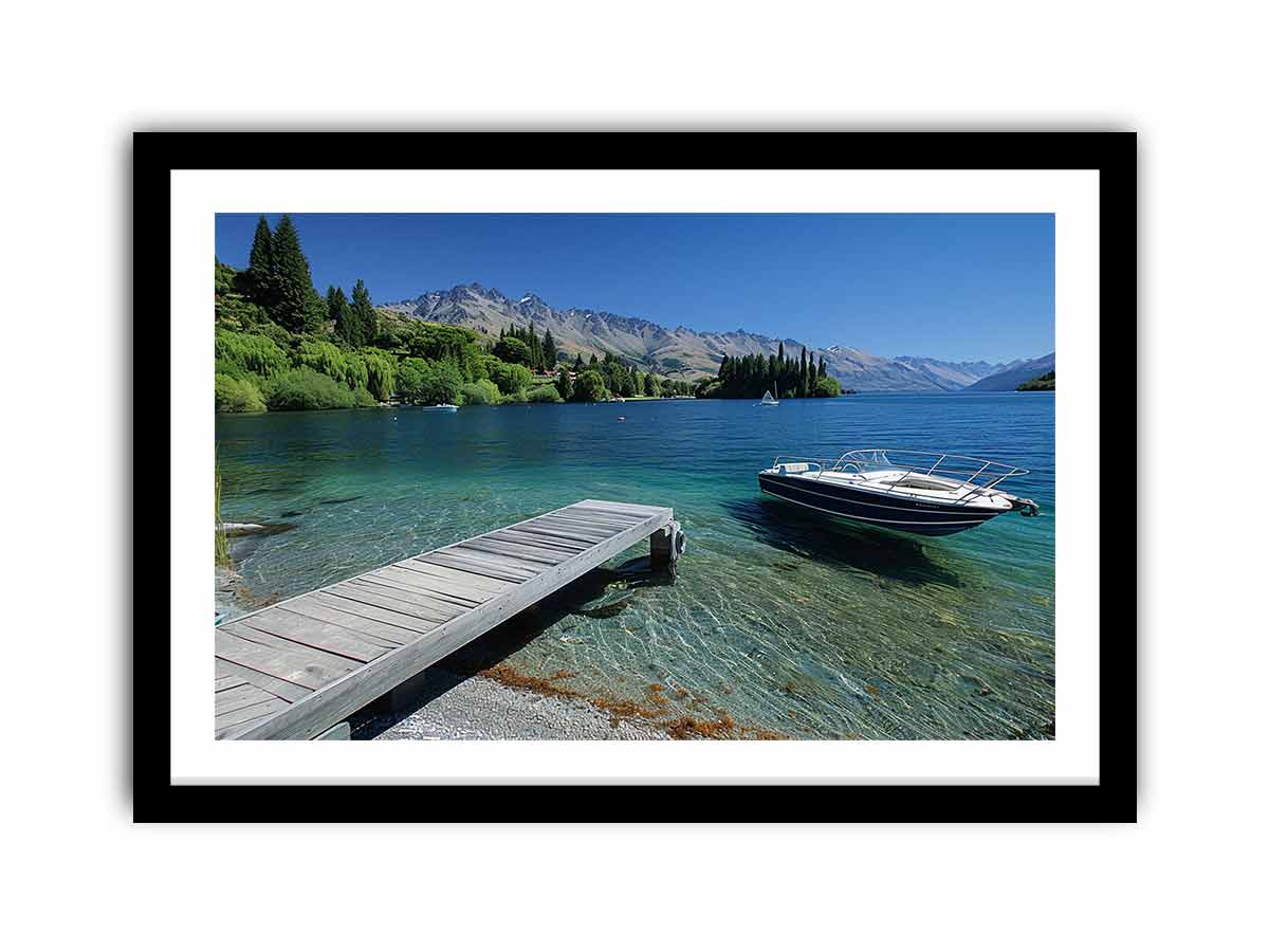 Mountain lake canvas art with dock, boat and clear blue water for modern interiors.