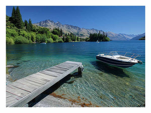 Mountain lake canvas art with dock, boat and clear blue water for modern interiors.
