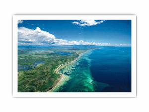 Aerial turquoise coastline and reef canvas art for coastal living room decor.
