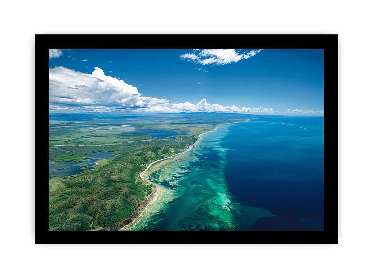 Aerial turquoise coastline and reef canvas art for coastal living room decor.