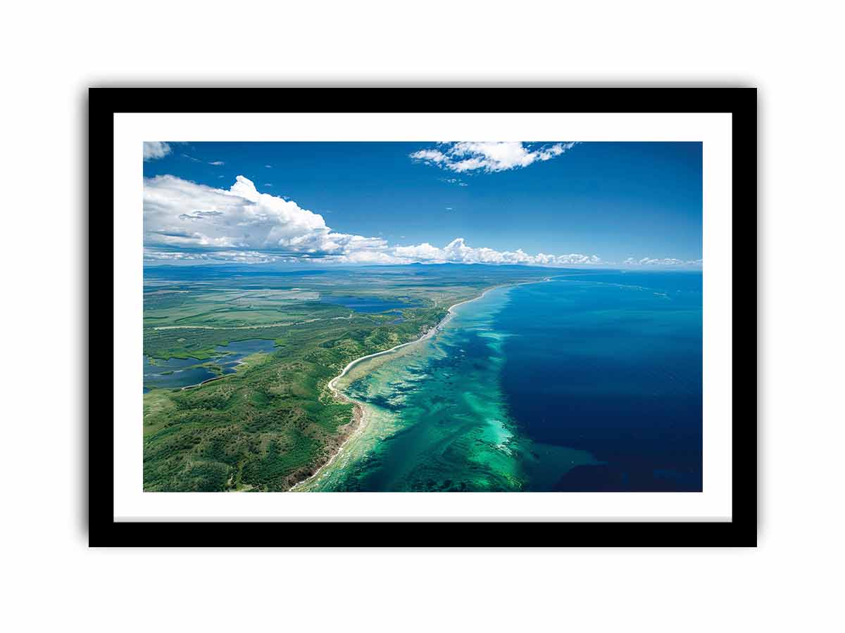 Aerial turquoise coastline and reef canvas art for coastal living room decor.