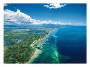 Aerial turquoise coastline and reef canvas art for coastal living room decor.