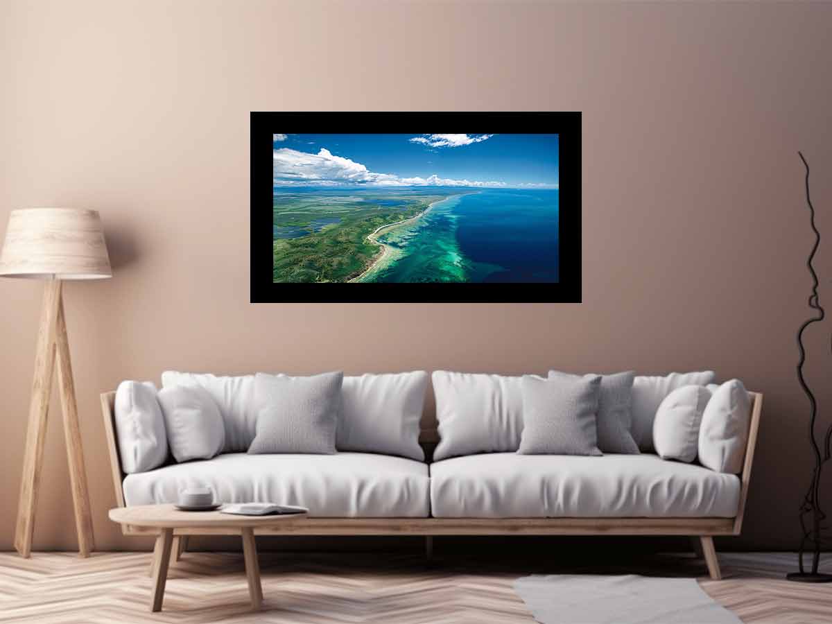 Aerial turquoise coastline and reef canvas art for coastal living room decor.