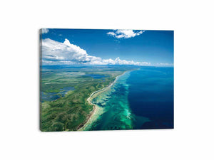 Aerial turquoise coastline and reef canvas art for coastal living room decor.