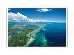Aerial turquoise coastline and reef canvas art for coastal living room decor.