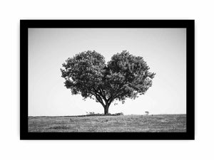 Black and white lone heart-shaped tree canvas art for minimalist room decor.