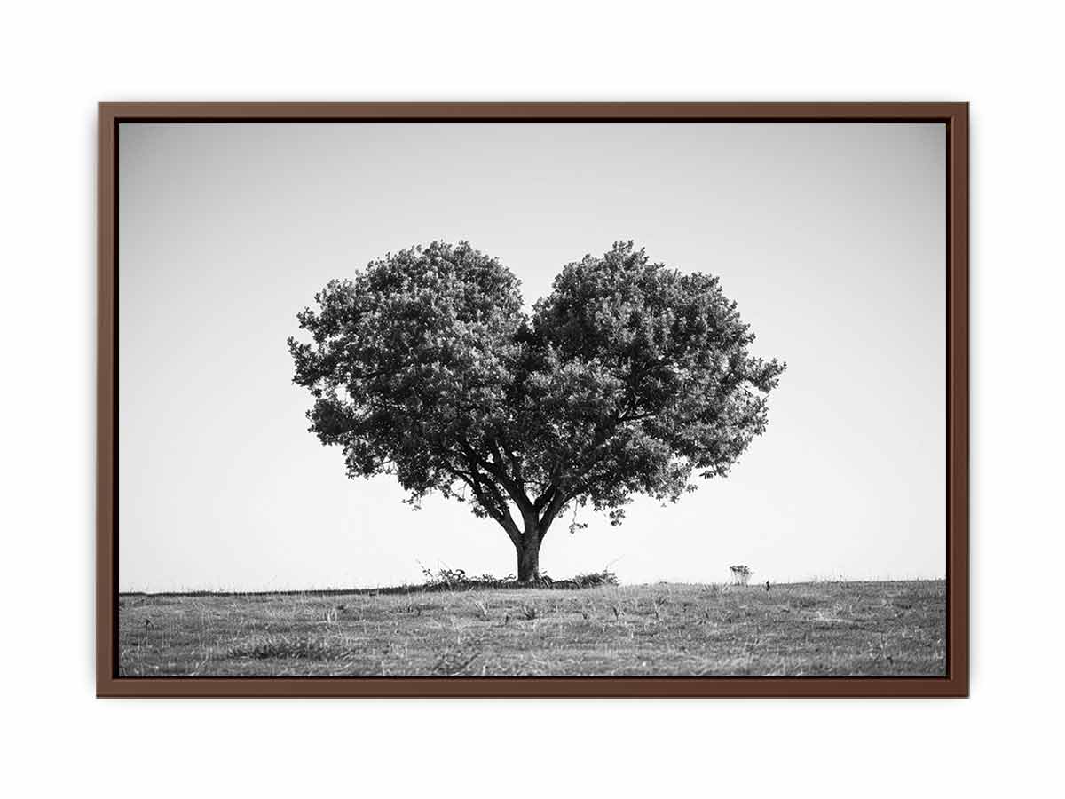 Black and white lone heart-shaped tree canvas art for minimalist room decor.
