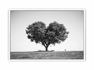 Black and white lone heart-shaped tree canvas art for minimalist room decor.