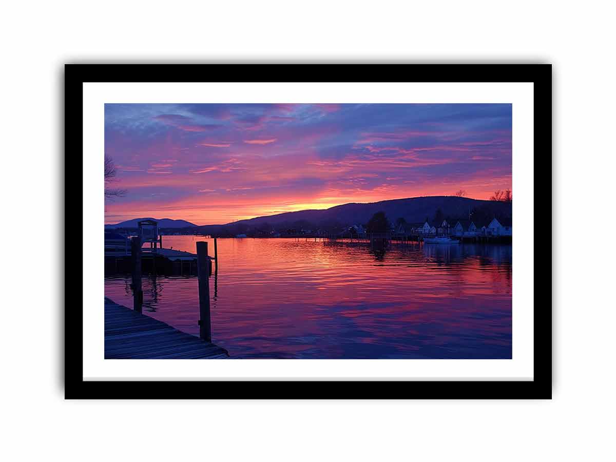 Sunset lake harbor canvas print with mountains and reflections for serene living room decor.