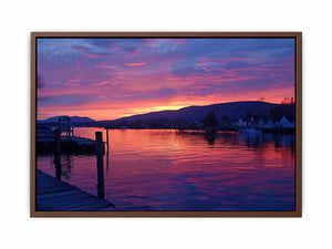 Sunset lake harbor canvas print with mountains and reflections for serene living room decor.