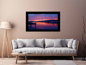 Sunset lake harbor canvas print with mountains and reflections for serene living room decor.
