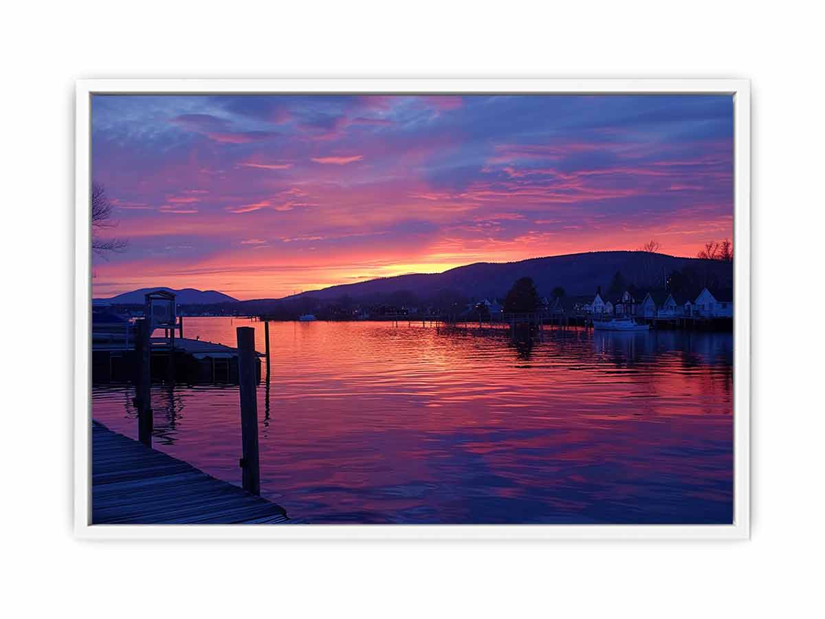 Sunset lake harbor canvas print with mountains and reflections for serene living room decor.