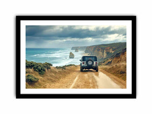 Off-road vehicle on a coastal dirt track overlooking turquoise waves, limestone sea stacks and golden cliffs beneath a cloudy sky