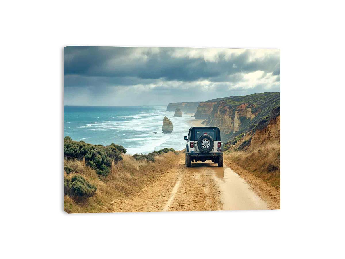 Off-road vehicle on a coastal dirt track overlooking turquoise waves, limestone sea stacks and golden cliffs beneath a cloudy sky