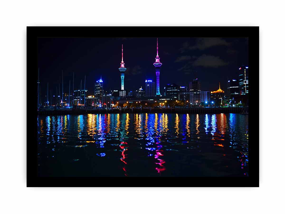 Neon city skyline canvas art with waterfront reflections for modern office decor.
