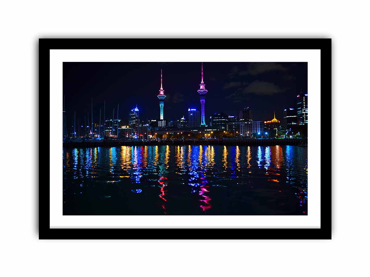 Neon city skyline canvas art with waterfront reflections for modern office decor.