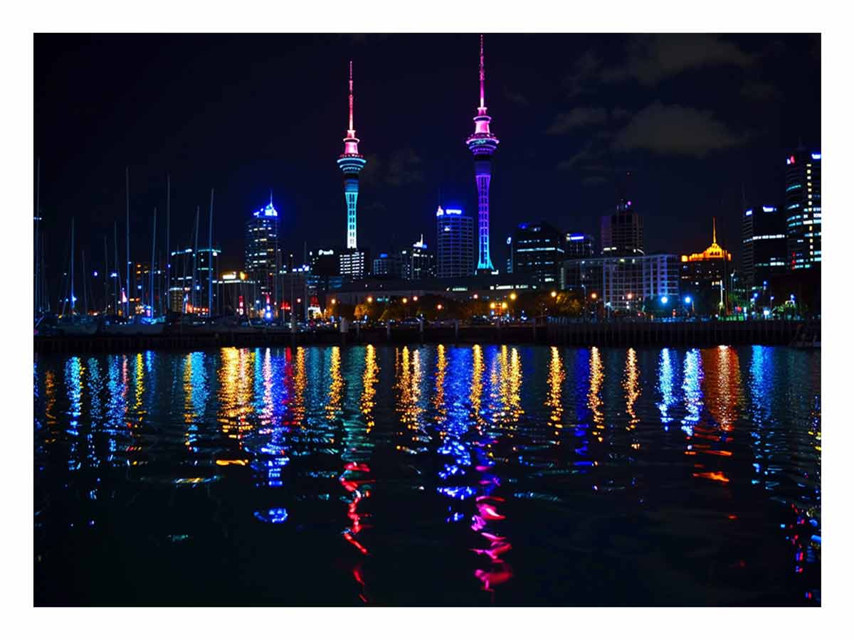Neon city skyline canvas art with waterfront reflections for modern office decor.