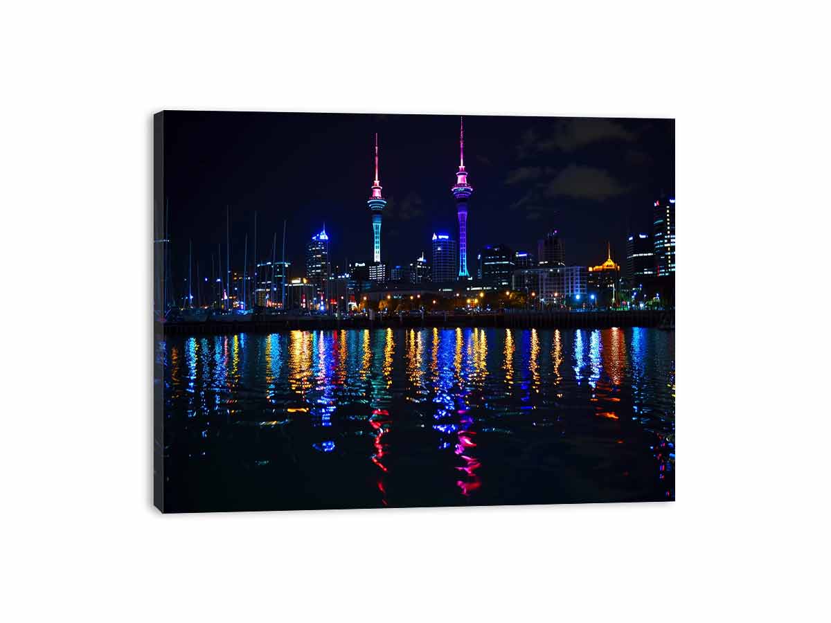 Neon city skyline canvas art with waterfront reflections for modern office decor.
