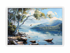 Blue lake landscape canvas art with mountains, trees, and birds for serene living room decor.