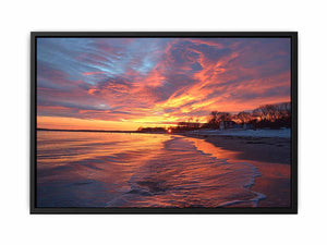 Dramatic coastal sunset canvas art for warm modern living room decor.