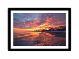 Dramatic coastal sunset canvas art for warm modern living room decor.