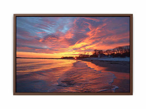Dramatic coastal sunset canvas art for warm modern living room decor.