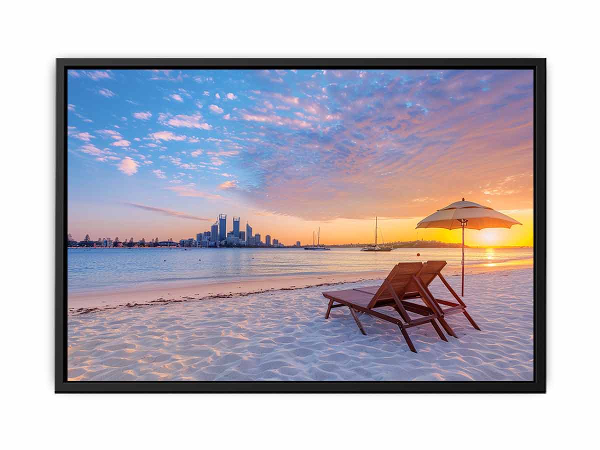 Coastal sunset canvas art with beach chairs and city skyline for relaxed living room decor.