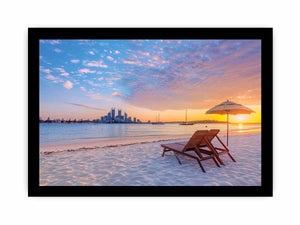 Coastal sunset canvas art with beach chairs and city skyline for relaxed living room decor.