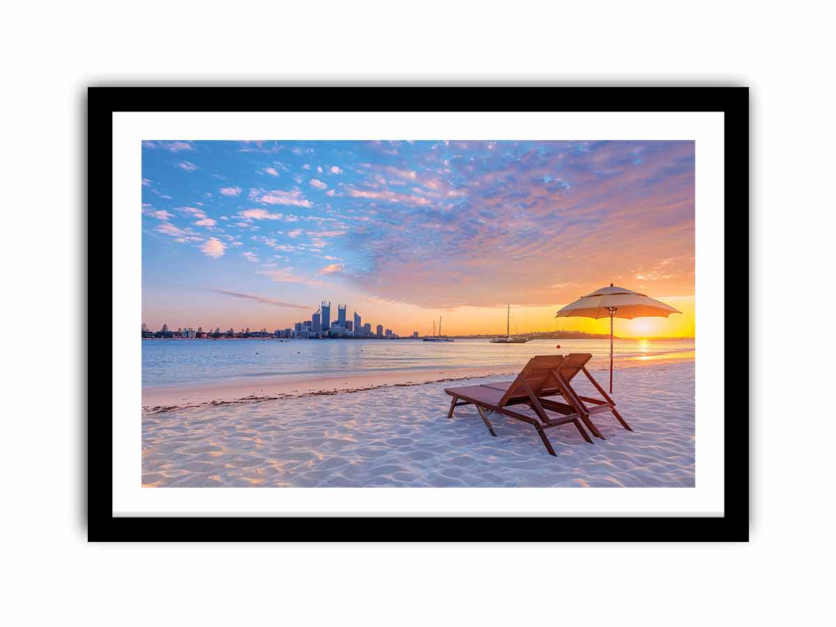 Coastal sunset canvas art with beach chairs and city skyline for relaxed living room decor.