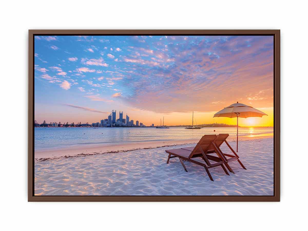 Coastal sunset canvas art with beach chairs and city skyline for relaxed living room decor.