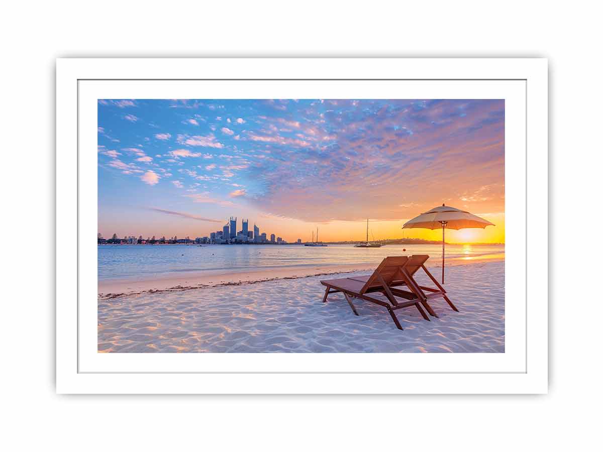 Coastal sunset canvas art with beach chairs and city skyline for relaxed living room decor.