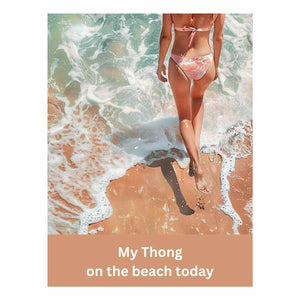 Woman walking on sandy beach with ocean foam and casual text for coastal bathroom decor.