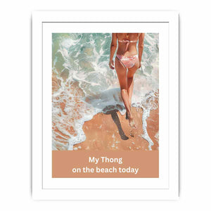 Woman walking on sandy beach with ocean foam and casual text for coastal bathroom decor.