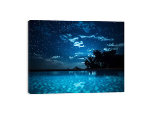 Celestial Pool Night star filled night sky above glowing turquoise pool water for modern home decor.