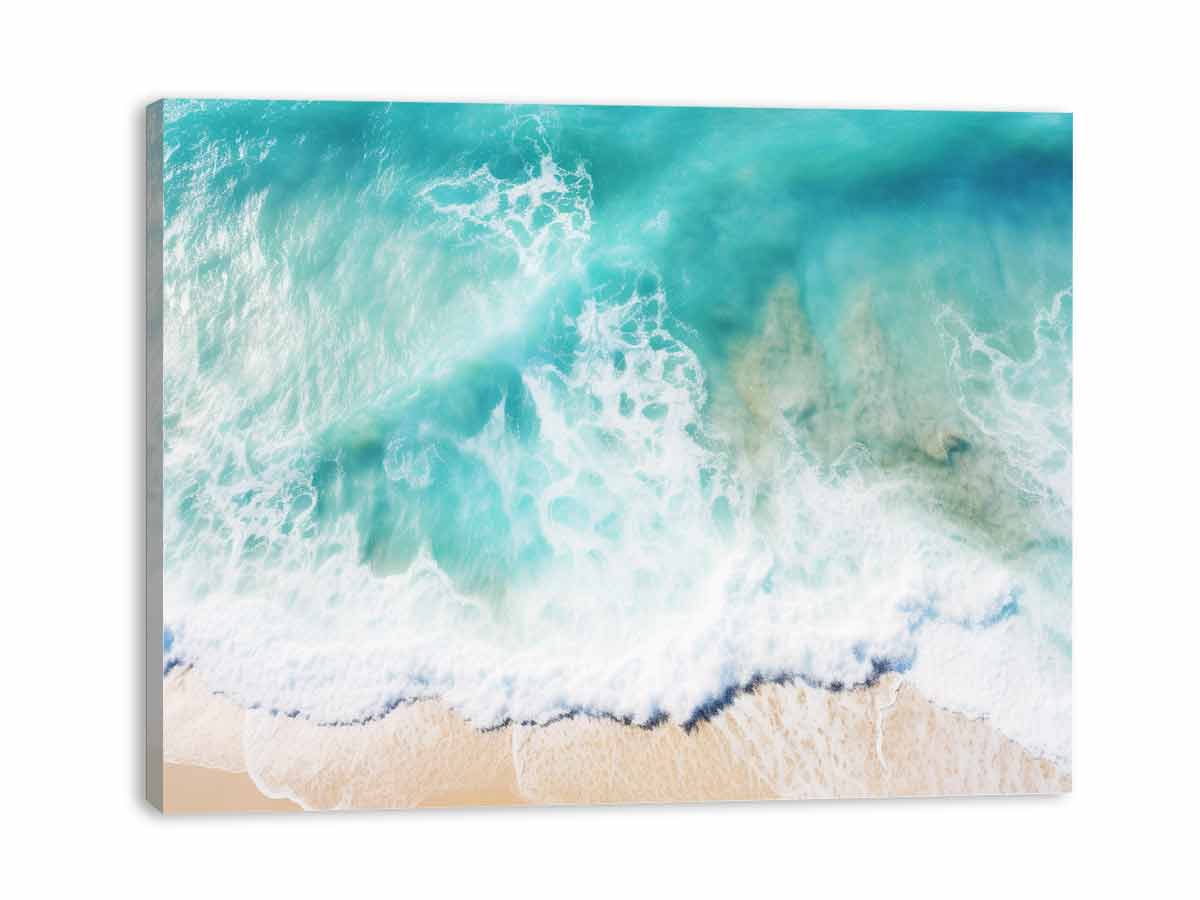 Aerial ocean wave canvas print for bright coastal living room decor.