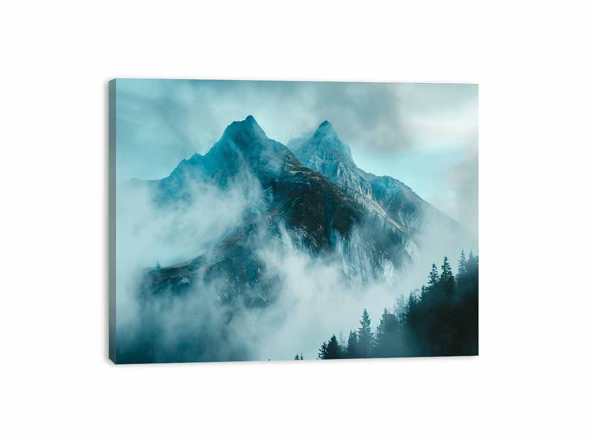 Misty blue mountain canvas art with fog and evergreen trees for modern living room decor.