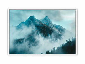Misty blue mountain canvas art with fog and evergreen trees for modern living room decor.