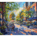 Colorful cafe street canvas art with trees and outdoor tables for modern living room decor.