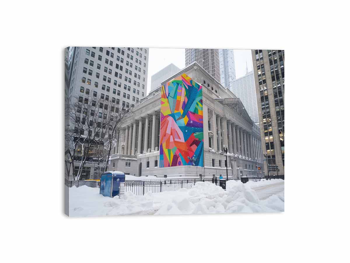 City architecture canvas print with colorful mural on snowy building for modern office decor.