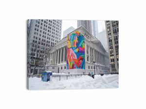 City architecture canvas print with colorful mural on snowy building for modern office decor.