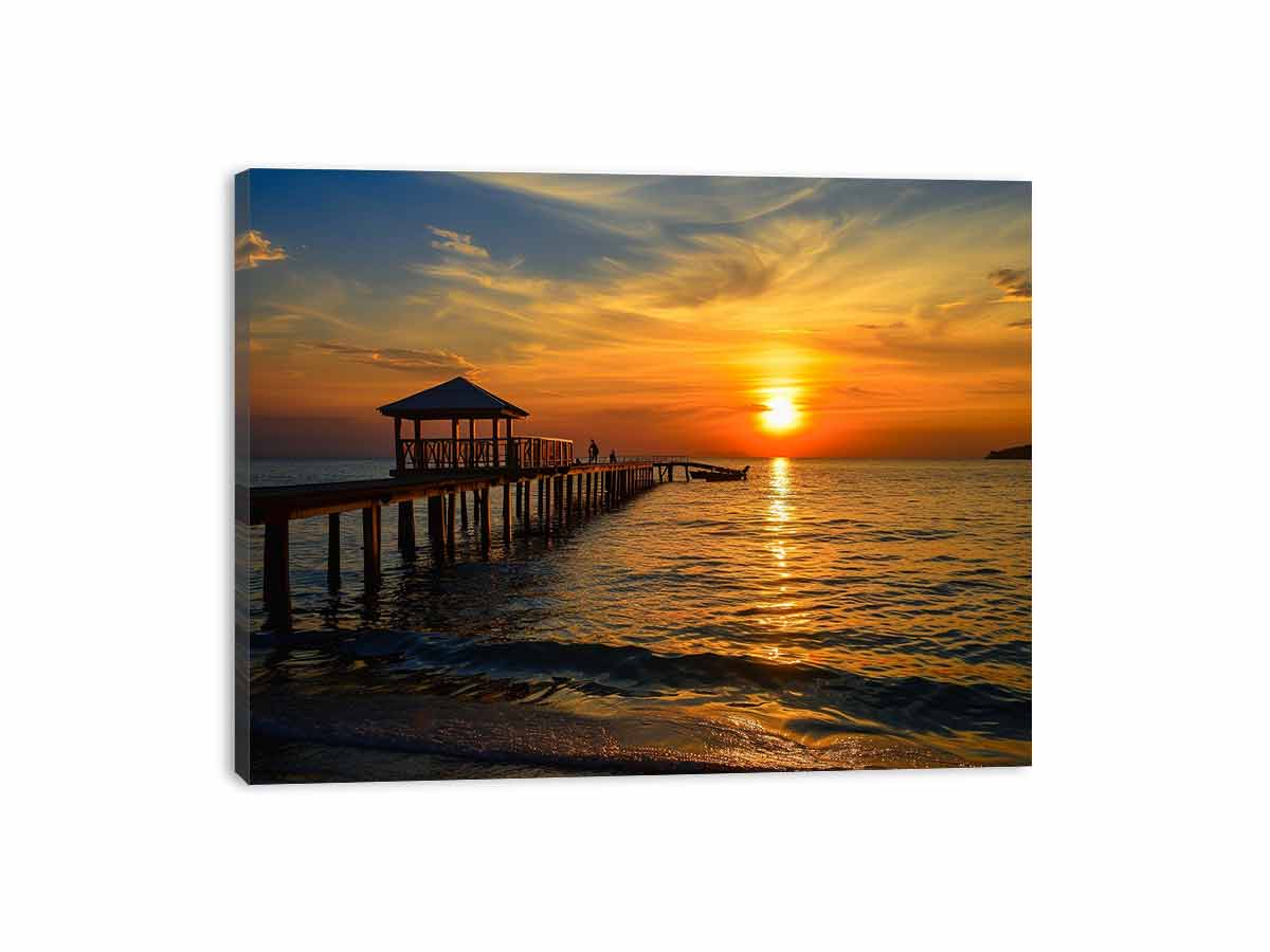 Golden sunset pier canvas print with ocean and gazebo for warm coastal living room decor.