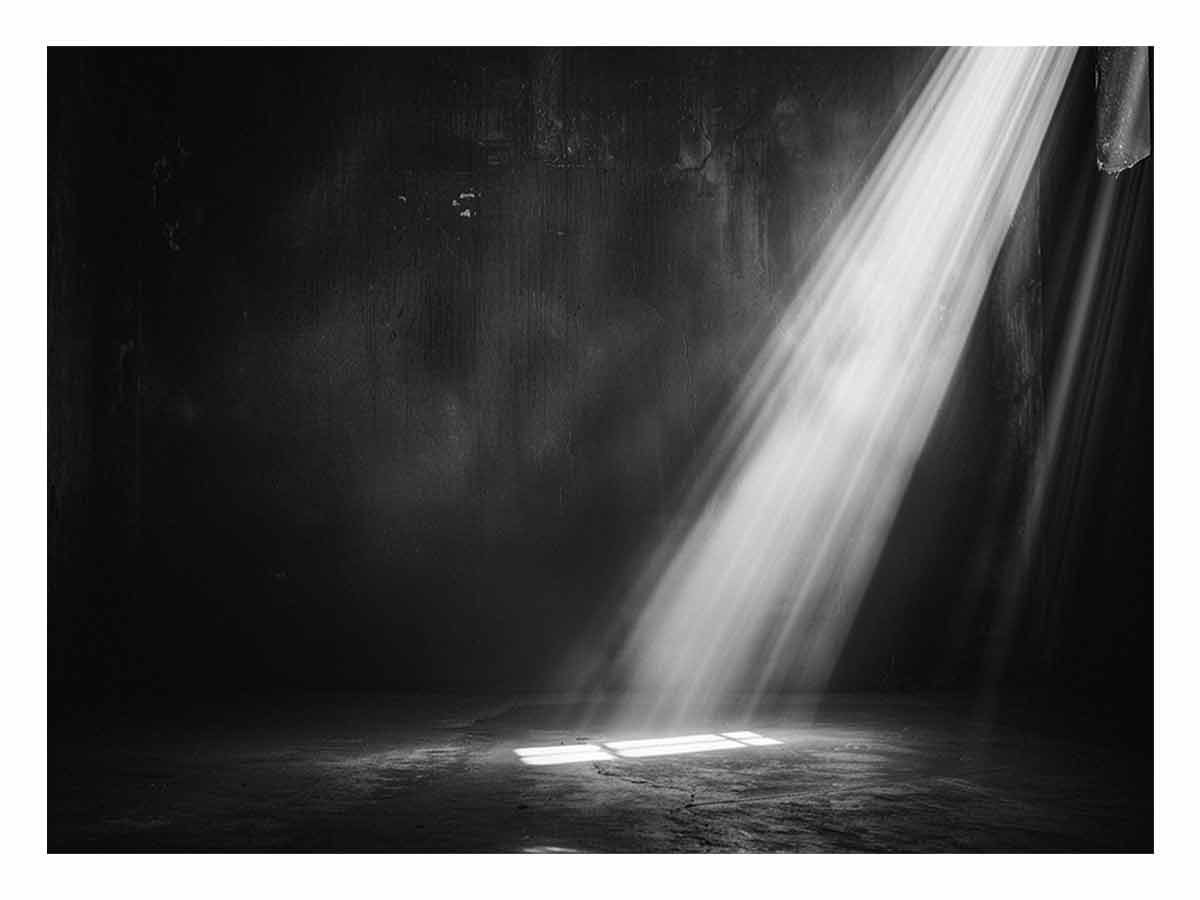 Dramatic black and white light beam entering a dark industrial room for modern living rooms decor.
