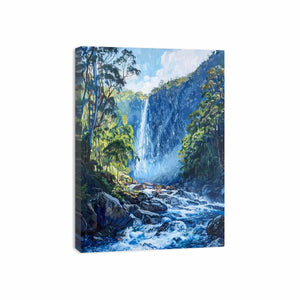 Lush forest waterfall flowing through rocky blue mountain stream for modern living rooms decor.