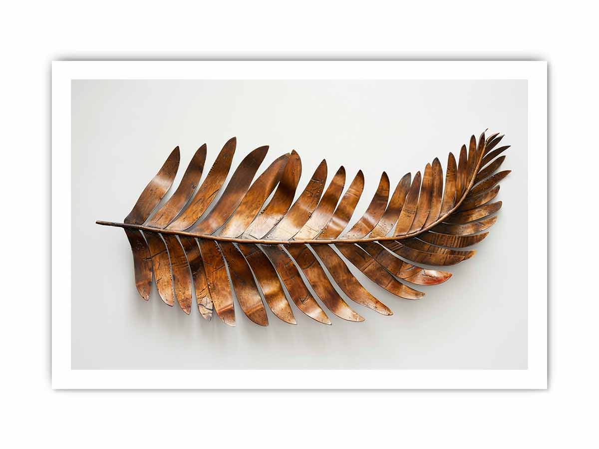 Metallic bronze palm leaf sculpture on a clean white background for modern living rooms decor.