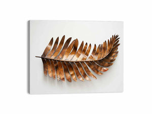 Metallic bronze palm leaf sculpture on a clean white background for modern living rooms decor.